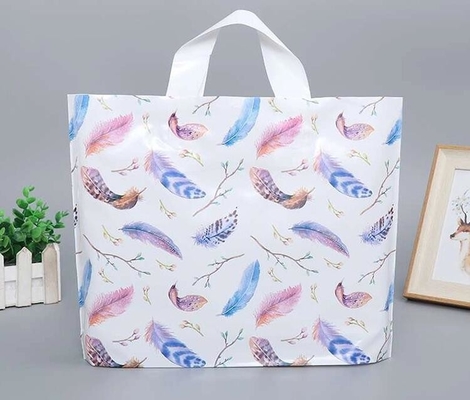 La manija cortada con tintas HDPE de encargo del ldpe de la impresión lleva el bolso de compras de empaquetado del polietileno de la ropa del plástico del regalo polivinílico de la mercancía con